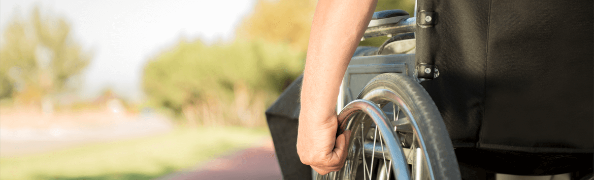 Image of person in a wheelchair outside